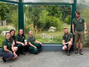 zookeepers in front of enclosure
