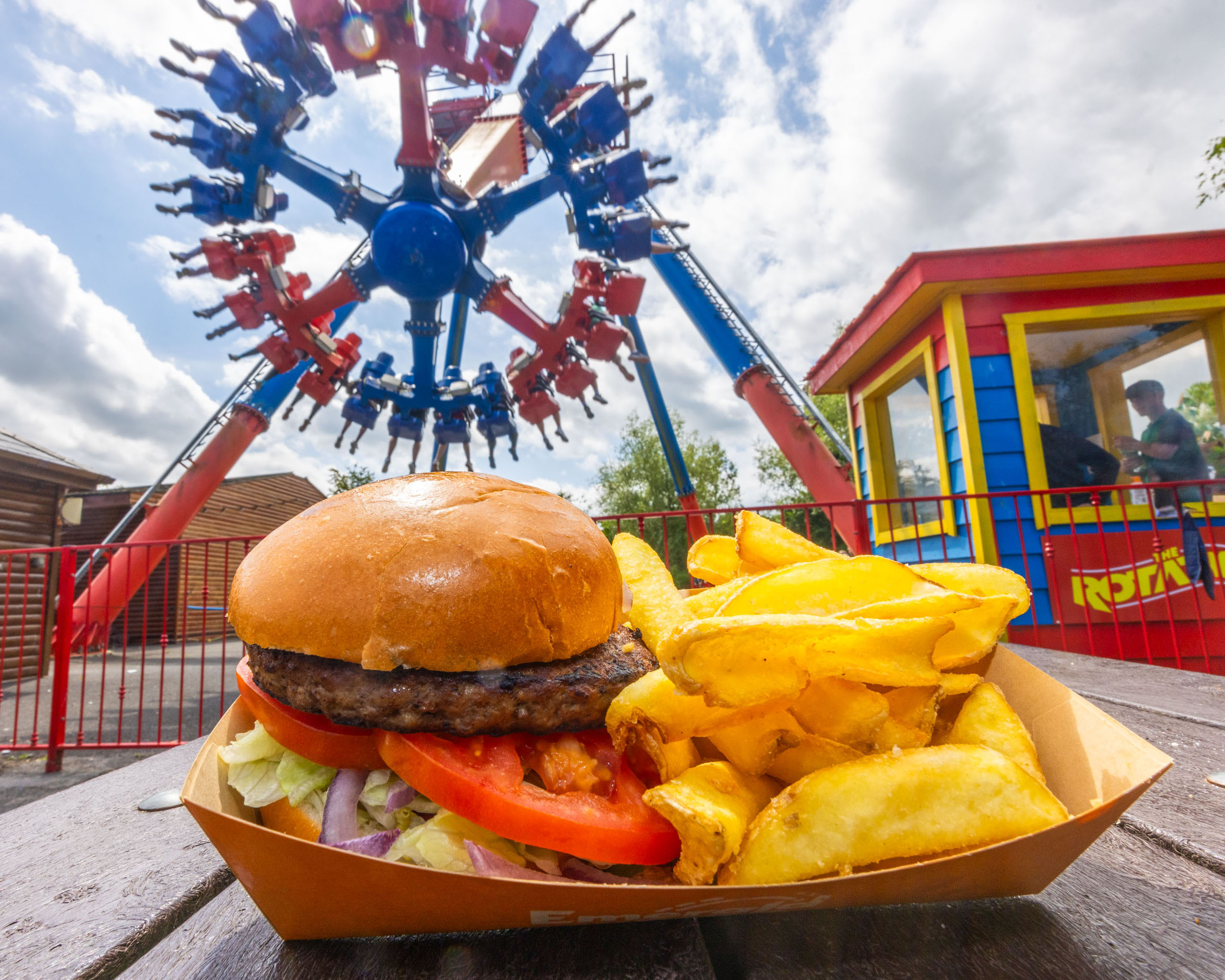 Burger and chips with The Rotator in the back